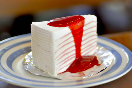 Crepe cake with strawberry sauce dishの写真素材