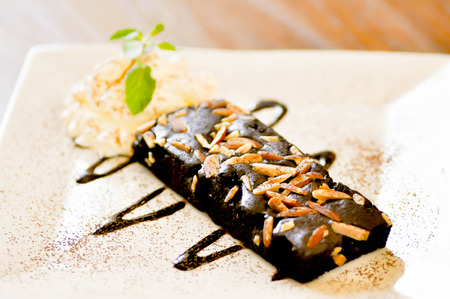 brownie cake with almond  and cream,brownieの写真素材