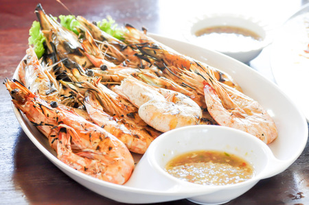 grilled prawn, grilled shrimp with sauceの写真素材