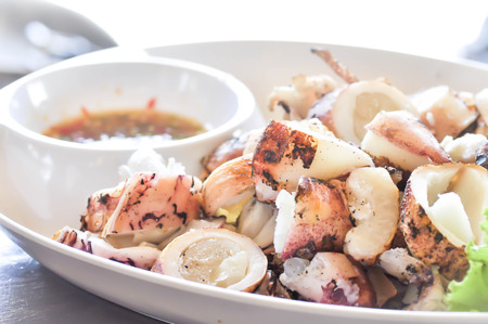 grilled squid dish with sauceの写真素材