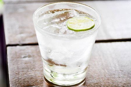a glass of soda and lime sliceの写真素材