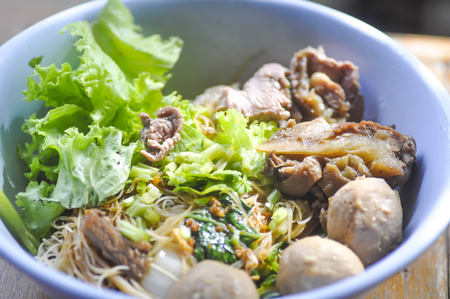 Chinese noodle with vegetable , meatball and beef dishの写真素材