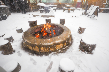 fire for warmth in snowyの写真素材
