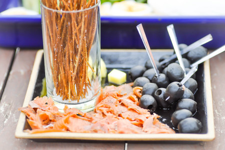 salmon ,cheese and black olive dishの写真素材