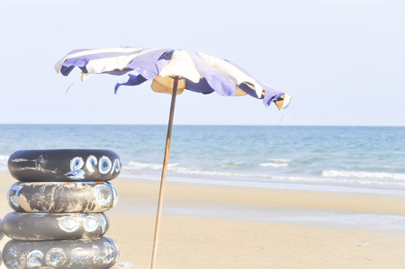 beach umbrella , sea and sky backgroundの写真素材