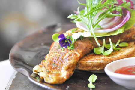 toast with omelette , vegetable and chili sauceの写真素材