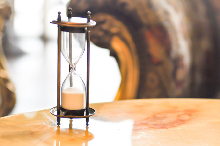 sandglass or hourglass on the table