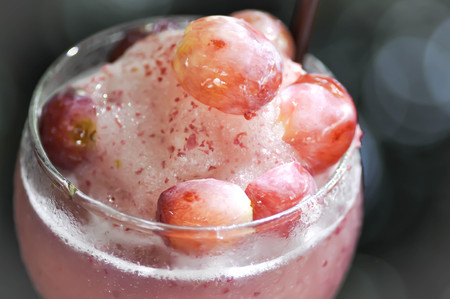 a glass of grape juice or grape smoothieの写真素材