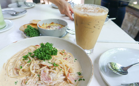 carbonara spaghetti , baked spinach with cheese and coffeeの写真素材