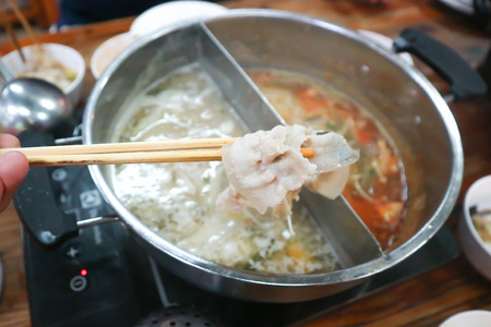 eating some sliced pork or  Sukiyakiの写真素材