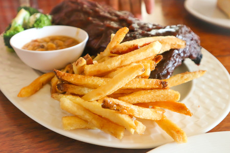 pork rib or pork steak with French friesの写真素材