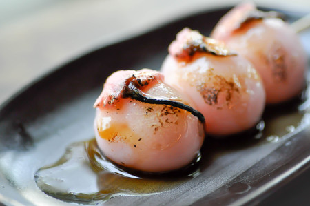 bun or dango or sakura dango with sakura flower toppingの写真素材