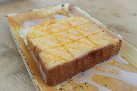 toast or bread with butter and cream topping