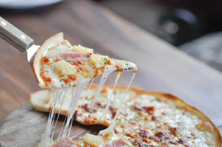 pizza in pizza peel or pizza oven peel paddleの写真素材