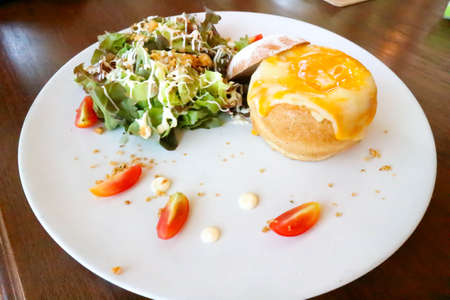 bread bowl soup or bread with stuffed and egg topping with salad dish