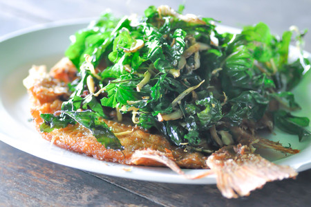 deep fried fish and fried holy basil topping