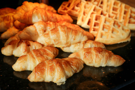 crossiant and waffle on the trayの写真素材