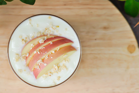 yogurt ,papaya yogurt with apple and oat toppingの写真素材