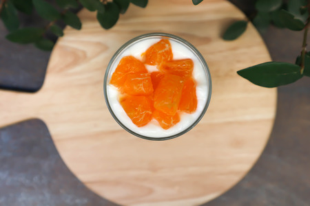 yogurt , yogurt with orange topping dishの写真素材