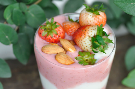 strawberry smoothie or strawberry yogurt with fruit toppingの写真素材
