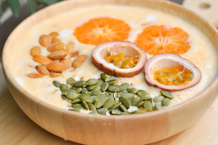 yogurt ,orange yogurt with fruit toppingの写真素材