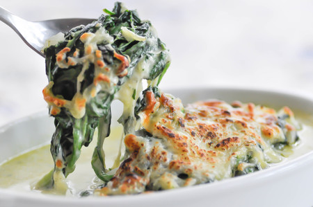 Baked spinach or Baked spinach with cheese dishの写真素材