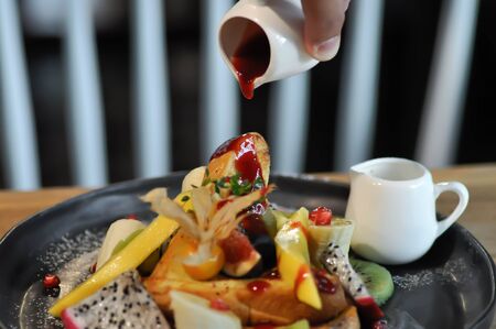 toast or French toast with fruit and sauceの写真素材