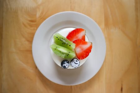 fruit cake or cheese cake with fruit toppingの写真素材