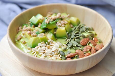 smoothie bowl, avocado yogurt with fruit topping or blended avocado dishの写真素材