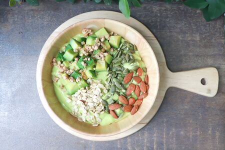 smoothie bowl, avocado yogurt with fruit topping or blended avocado dishの写真素材