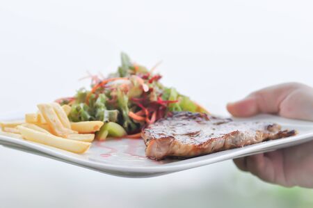 grilled pork, roasted pork or Barbecued pork with salad and French fries