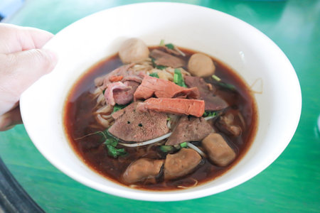 serving Chinese noodle or beef noodle