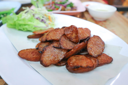 fried pork sausage or fried Chinese sausageの写真素材