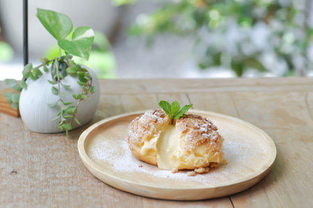choux cream or cream puff, eclair in the wooden dishの写真素材