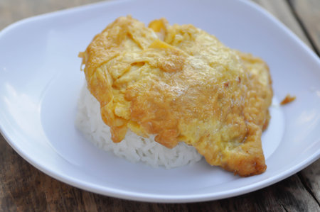 omelette, omelet or deep fried egg and rice dishの写真素材