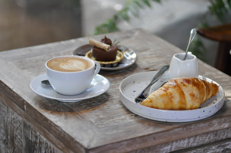 croissant , French croissant or French bread with chocolate cake and coffeeの写真素材