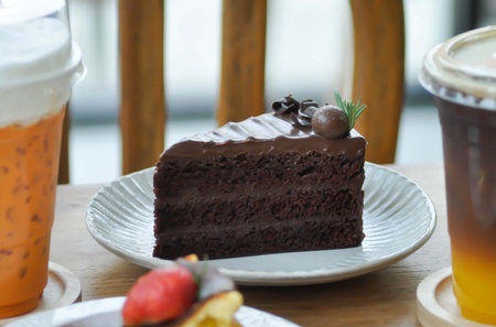 chocolate cake or layer cake and some drink
