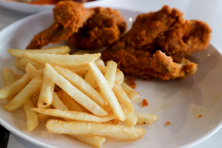 fried chicken, deep fried chicken or chicken wing and French friesの写真素材
