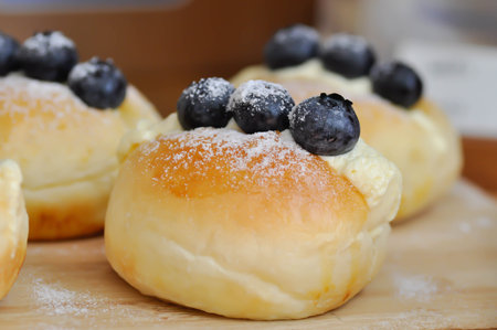 cheese bun, mozzarella cheese bun or bun or donut with blueberry topping