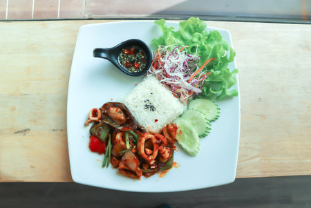 stir fried squid and mussel with rice and vegetable, spicy squid and mussel for serve