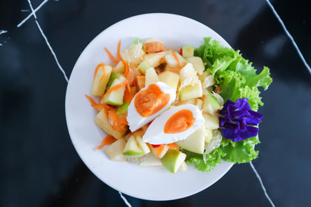 fruit salad or spicy salad, apple and egg salad for serveの写真素材