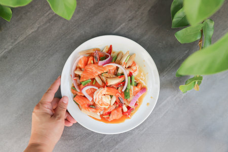 salmon and shrimp salad , spicy salad or spicy seafood salad for serveの写真素材