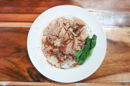 pork and rice or stewed pork or boiled pork, fresh ham on rice or rice topped with porkの写真素材