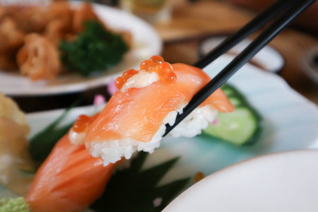 salmon sushi ,sushi or rice topped with salmon or salmon rollsの写真素材
