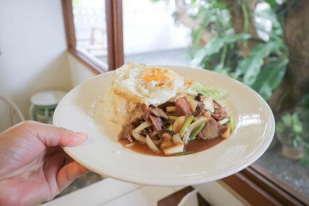 stir fried pork with vegetable , rice and sunny side up egg or stewed pork with egg and rice or stir fried mushroom and porkの写真素材