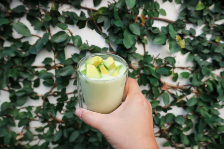 blended avocado , avocado smoothie or avocado  yogurt or avocado milk for serveの写真素材
