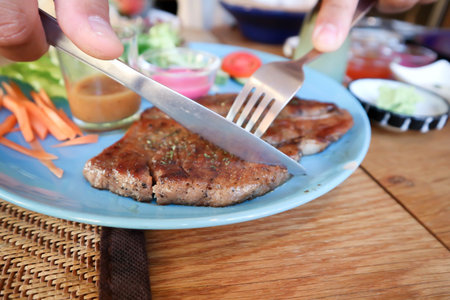 grilled pork or roasted pork , pork steak and saladの写真素材