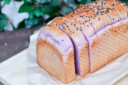 loaf of bread ,sweet potato bread with sesame toppingの写真素材