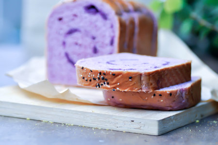 loaf of bread ,sweet potato bread with sesame toppingの写真素材