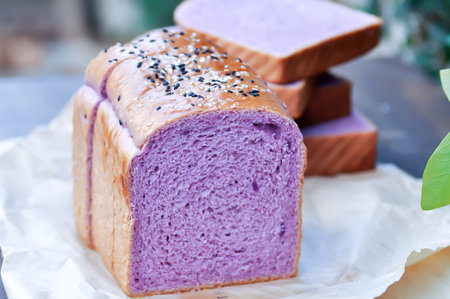 loaf of bread ,sweet potato bread with sesame toppingの写真素材